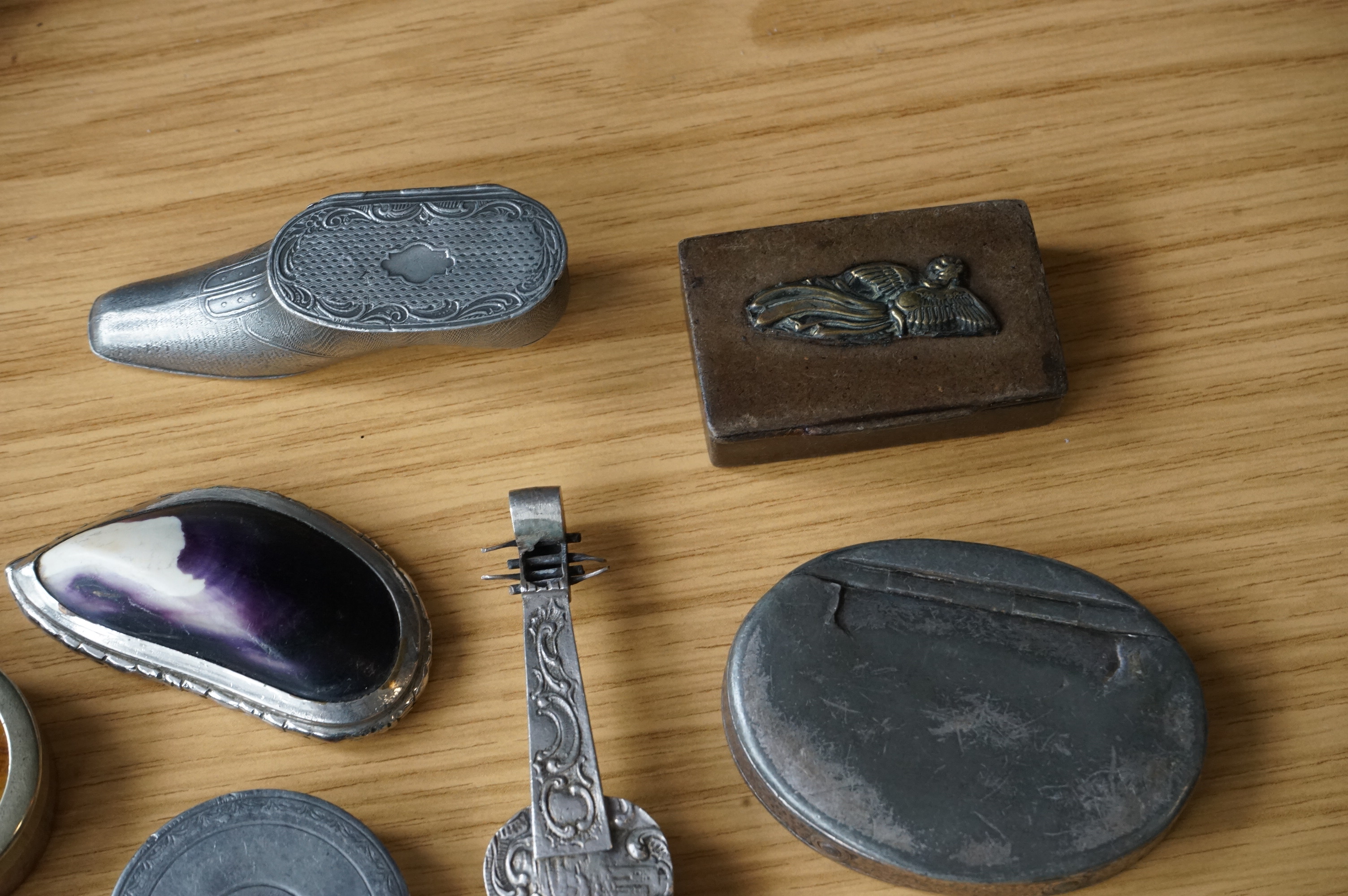 A collection of mixed metal stuff boxes including a novelty cello shaped box being 12cm long